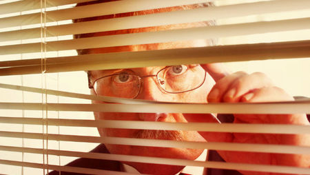 Micromanaging boss watching through blinds