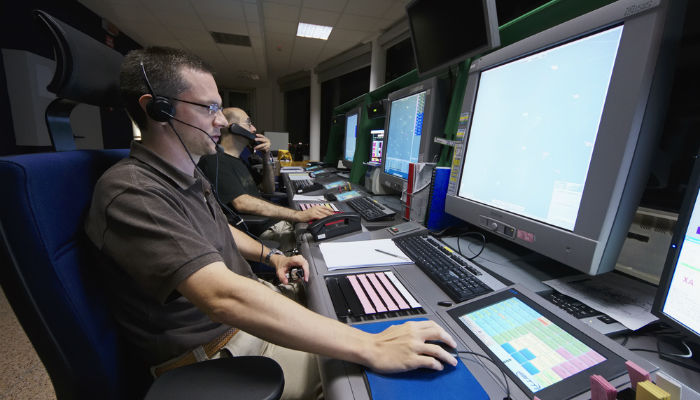 Group of air traffic controllers working at night at the Venice International Airport in Italy