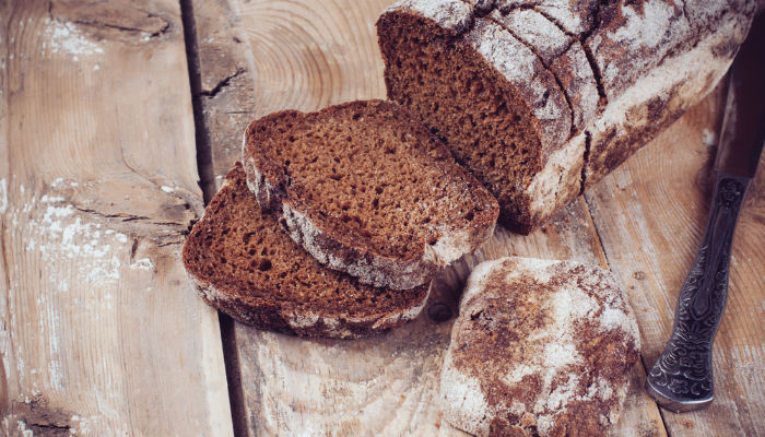 Sliced rye bread on a wooden board