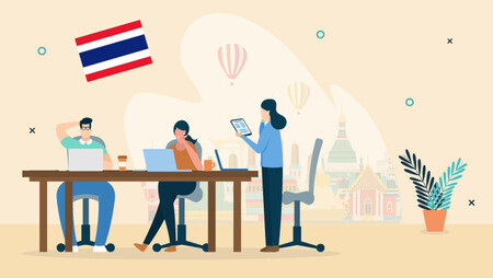 Illustration of two people working on their laptops and sitting at a desk and another woman standing there while holding a tablet, there is a backdrop of Bangkok and the Thai flag