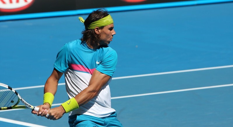 Influential Spanish tennis champion Rafael Nadal playing tennis