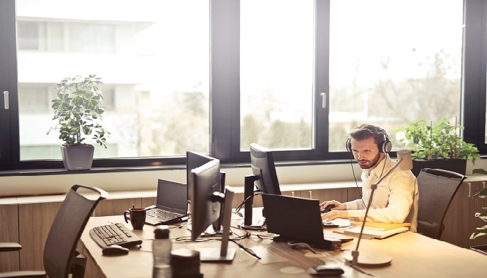 A man working in a brightly lit office