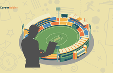 man working on laptop over a stadium